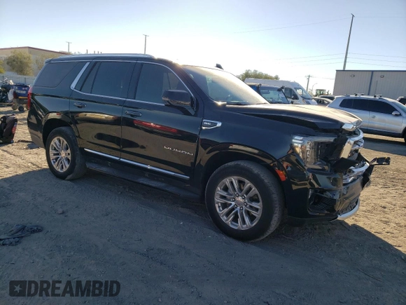 2022 GMC Yukon SLT with VIN 1GKS2BKD5NR356479, listed as a Copart auction lot 77674304 with 33,580 mi miles and Salvage Title. Bid and sale history available at carsss.com. Image 4.