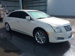2013 Cadillac XTS Premium with VIN 2G61S5S35D9103948, listed as a IAAI auction lot 42090444 with 154,728 mi miles. Bid and sale history available at carsss.com. Image 1.