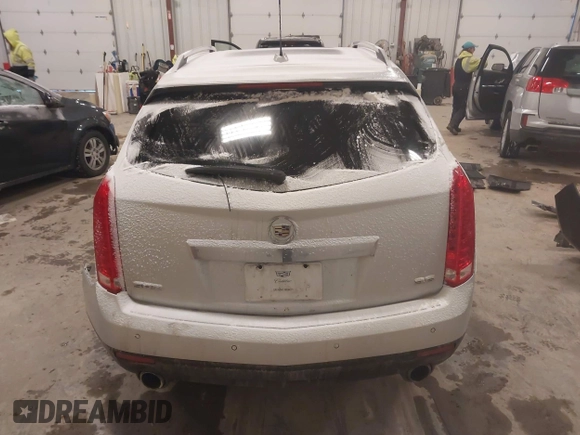 2016 Cadillac SRX Luxury Collection z VIN 3GYFNBE36GS572780, wystawiony jako IAAI lot #41347399 z przebiegiem 166 436 mil mil oraz . Historia ofert i sprzedaży dostępna na DreamBid. Obrazek 16.