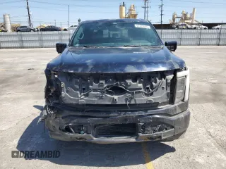 2022 Ford F-150 Lightning Pro z VIN 1FT6W1EV8NWG04113, wystawiony jako Copart lot #57489635 z przebiegiem 48 990 mil mil oraz Szkody całkowita. Historia ofert i sprzedaży dostępna na DreamBid. Obrazek 5.