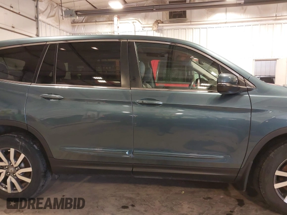 2019 Honda Pilot EX-L with VIN 5FNYF6H5XKB094879, listed as a IAAI auction lot 41265415 with 58,700 mi miles and . Bid and sale history available at DreamBid. Image 14.