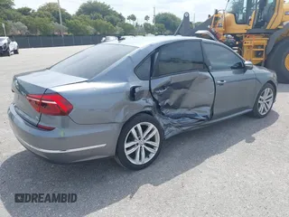 2019 Volkswagen Passat 2.0T Wolfsburg Edition with VIN 1VWLA7A35KC011084, listed as a IAAI auction lot 40385111 with 81,119 mi miles. Bid and sale history available at carsss.com. Image 4.