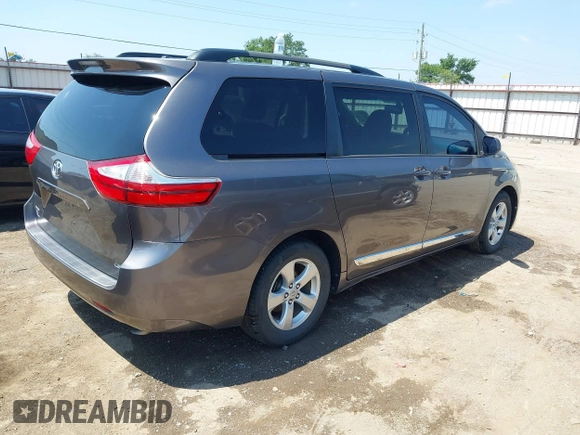 2015 Toyota Sienna LE AAS with VIN 5TDKK3DC4FS617903, listed as a IAAI auction lot 42390155 with 151,975 mi miles and . Bid and sale history available at DreamBid. Image 4.