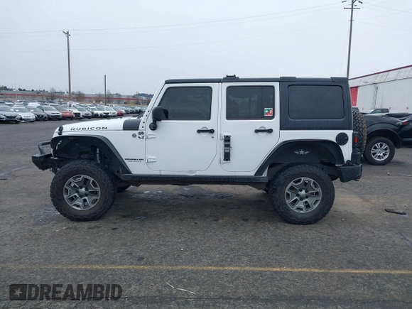 2014 Jeep Wrangler Unlimited Rubicon with VIN 1C4BJWFGXEL283929, listed as a IAAI auction lot 41812052 with 137,790 mi miles and . Bid and sale history available at DreamBid. Image 14.