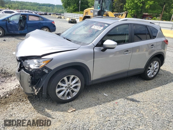 2014 Mazda CX-5 Grand Touring with VIN JM3KE4DY9E0416967, listed as a Copart auction lot 54215285 with 77,296 mi miles and Salvage Title. Bid and sale history available at DreamBid. Image 1.