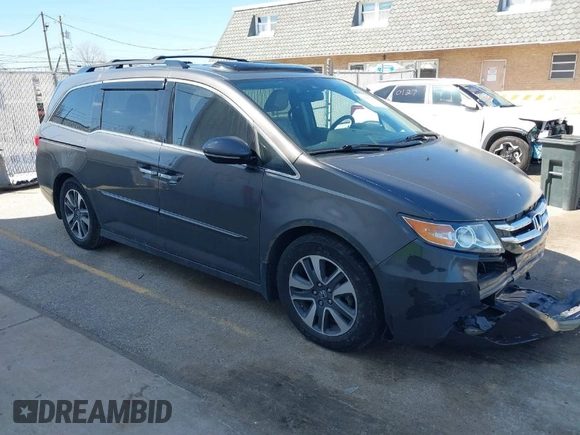 2014 Honda Odyssey Touring with VIN 5FNRL5H97EB101169, listed as a IAAI auction lot 41869233 with 142,147 mi miles and . Bid and sale history available at DreamBid. Image 1.