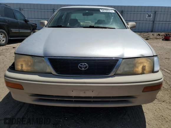 1997 Toyota Avalon XL with VIN 4T1BF12B0VU187179, listed as a Copart auction lot 54708565 with 336,922 mi miles and Salvage Title. Bid and sale history available at DreamBid. Image 5.