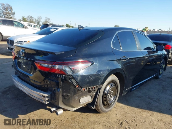 2021 Toyota Camry SE Nightshade with VIN 4T1G11AK2MU477363, listed as a IAAI auction lot 41675959 with 57,507 mi miles. Bid and sale history available at carsss.com. Image 4.