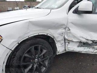 2014 Dodge Durango SXT with VIN 1C4RDJAG0EC561950, listed as a IAAI auction lot 42650331 with 106,959 mi miles and . Bid and sale history available at DreamBid. Image 6.