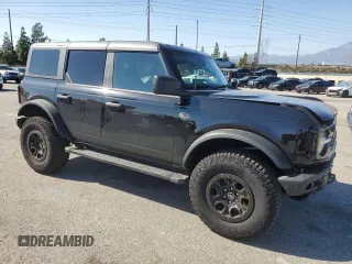 2024 Ford Bronco Wildtrak z VIN 1FMEE2BP1RLA54539, wystawiony jako Copart lot #46310905 z przebiegiem 12 545 mil mil oraz Szkody całkowita. Historia ofert i sprzedaży dostępna na DreamBid. Obrazek 4.