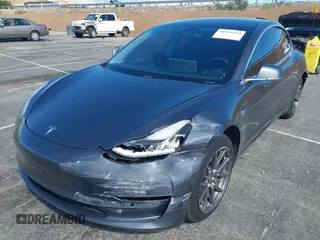 2019 Tesla Model 3 Mid Range with VIN 5YJ3E1EA6KF307456, listed as a IAAI auction lot 41944454 with 99,059 mi miles and . Bid and sale history available at DreamBid. Image 6.