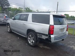 2015 Chevrolet Suburban LT z VIN 1GNSCJKC2FR144528, wystawiony jako IAAI lot #42320028 z przebiegiem 226 076 mil mil oraz . Historia ofert i sprzedaży dostępna na DreamBid. Obrazek 3.