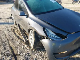 2022 Tesla Model Y Long Range with VIN 7SAYGAEE6NF361883, listed as a IAAI auction lot 41752441 with 50,493 mi miles and . Bid and sale history available at DreamBid. Image 6.