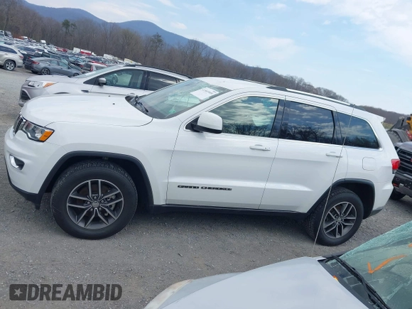 2018 Jeep Grand Cherokee Laredo z VIN 1C4RJFAG1JC479838, wystawiony jako IAAI lot #41903955 z przebiegiem 73 076 mil mil oraz . Historia ofert i sprzedaży dostępna na DreamBid. Obrazek 14.