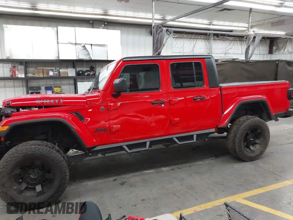 2022 Jeep Gladiator Altitude z VIN 1C6HJTAGXNL117353, wystawiony jako IAAI lot #42427921 z przebiegiem 28 801 mil mil oraz . Historia ofert i sprzedaży dostępna na DreamBid. Obrazek 14.