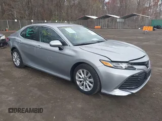 2019 Toyota Camry LE z VIN 4T1B11HK9KU851075, wystawiony jako IAAI lot #41911090 z przebiegiem 114 762 mil mil oraz . Historia ofert i sprzedaży dostępna na DreamBid. Obrazek 1.