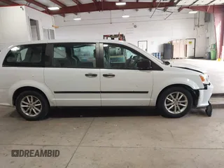 2014 Dodge Grand Caravan American Value with VIN 2C4RDGBG7ER345277, listed as a IAAI auction lot 42061355 with 145,889 mi miles and . Bid and sale history available at DreamBid. Image 13.