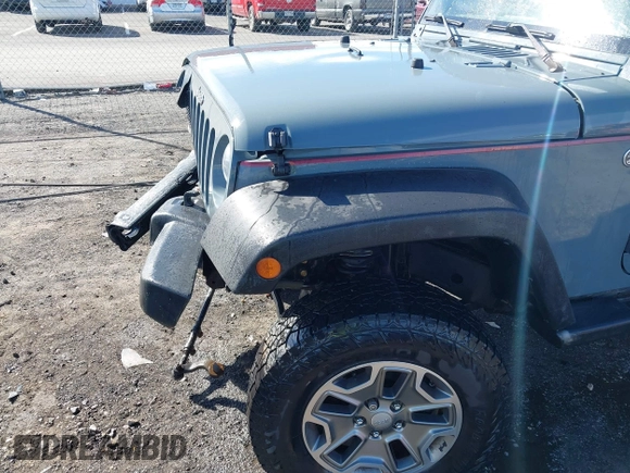 2015 Jeep Wrangler Unlimited Willys Wheeler with VIN 1C4BJWDG4FL589822, listed as a IAAI auction lot 41732614 with 149,112 mi miles and . Bid and sale history available at DreamBid. Image 19.