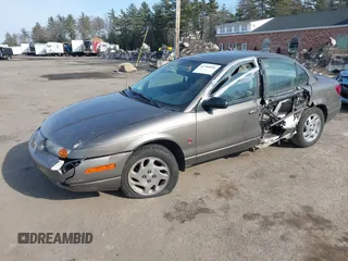 2000 Saturn SL z VIN 1G8ZK5275YZ244530, wystawiony jako IAAI lot #41784896 z przebiegiem 50 332 mil mil oraz . Historia ofert i sprzedaży dostępna na DreamBid. Obrazek 2.