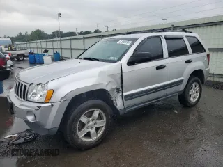 2005 Jeep Grand Cherokee Laredo with VIN 1J4GR48K55C719634, listed as a Copart auction lot 61809195 with 141,316 mi miles and Salvage title. Bid and sale history available at DreamBid. Image 1.