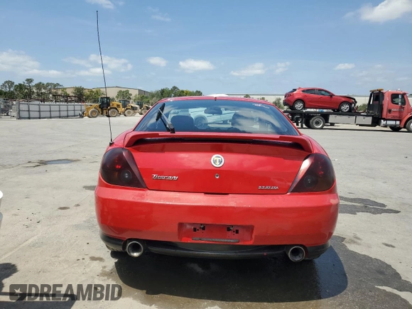 2003 Hyundai Tiburon GT z VIN KMHHN65F33U088538, wystawiony jako Copart lot #54320955 z przebiegiem 220 732 mil mil oraz Szkoda całkowita • Salvage title. Historia ofert i sprzedaży dostępna na DreamBid. Obrazek 6.