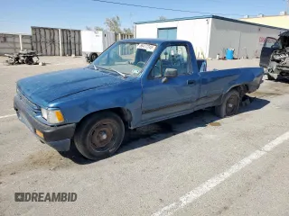 1989 Toyota Pickup z VIN JT4VN82D9K0000118, wystawiony jako Copart lot #56477245 z przebiegiem 177 475 mil mil oraz Szkoda całkowita • Salvage title. Historia ofert i sprzedaży dostępna na DreamBid. Obrazek 1.