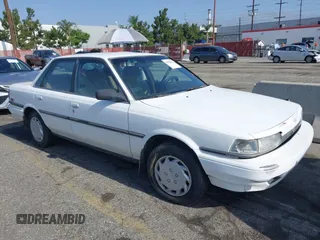 1991 Toyota Camry DLX z VIN 4T1SV21E2MU414777, wystawiony jako IAAI lot #42552215 z przebiegiem 258 081 mil mil oraz . Historia ofert i sprzedaży dostępna na DreamBid. Obrazek 1.