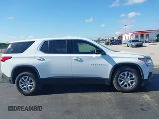 2021 Chevrolet Traverse LS with VIN 1GNERFKW0MJ240592, listed as a IAAI auction lot 42310680 with 59,986 mi miles and . Bid and sale history available at DreamBid. Image 13.