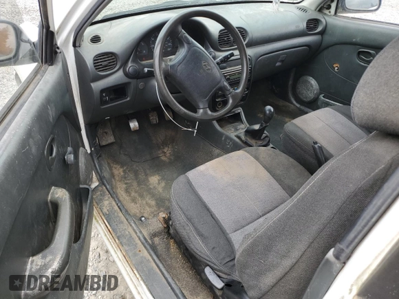 1999 Hyundai Accent with VIN KMHVD14N9XU503210, listed as a Copart auction lot 56486325 with 195,501 mi miles and Salvage title. Bid and sale history available at DreamBid. Image 8.