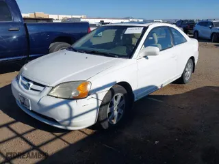 2003 Honda Civic EX with VIN 1HGEM22933L062174, listed as a IAAI auction lot 42024613 with 212,905 mi miles. Bid and sale history available at carsss.com. Image 2.