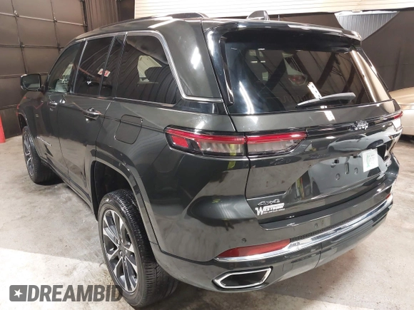 2023 Jeep Grand Cherokee Overland with VIN 1C4RJHDG0P8701157, listed as a IAAI auction lot 42080201 with 24,709 mi miles and . Bid and sale history available at DreamBid. Image 3.