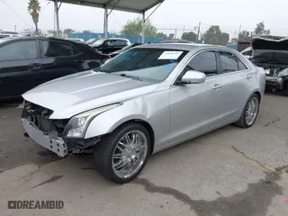 2013 Cadillac ATS Luxury with VIN 1G6AB5RX9D0156834, listed as a IAAI auction lot 41870392 with 60,952 mi miles. Bid and sale history available at carsss.com. Image 2.