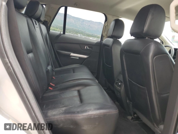 2013 Ford Edge Limited z VIN 2FMDK4KC3DBA75902, wystawiony jako Copart lot #58465245 z przebiegiem 219 934 mil mil oraz Szkoda całkowita • Salvage title. Historia ofert i sprzedaży dostępna na DreamBid. Obrazek 11.