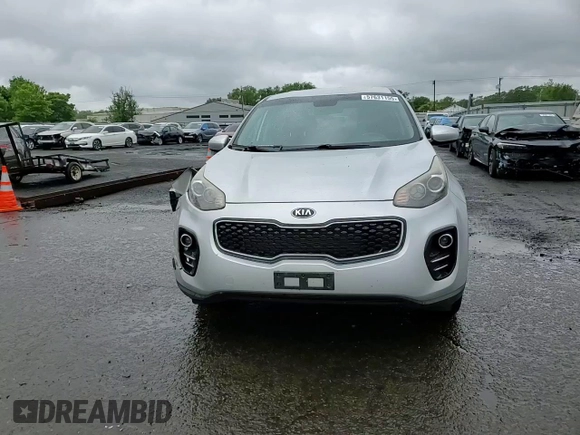 2017 Kia Sportage LX z VIN KNDPMCAC4H7036399, wystawiony jako Copart lot #57631155 z przebiegiem 89 803 mil mil oraz Szkoda całkowita • Salvage title. Historia ofert i sprzedaży dostępna na DreamBid. Obrazek 13.