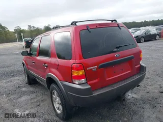 2004 Ford Escape XLT with VIN 1FMYU93114KB05975, listed as a IAAI auction lot 41929538 with 161,461 mi miles. Bid and sale history available at carsss.com. Image 3.