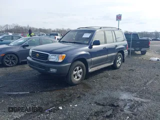 2002 Toyota Land Cruiser with VIN JTEHT05J122018974, listed as a IAAI auction lot 41543290 with 266,926 mi miles. Bid and sale history available at carsss.com. Image 2.