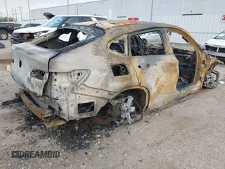 2020 BMW X4 xDrive30i with VIN 5UX2V1C00L9B30132, listed as a IAAI auction lot 41769464 with Not provided miles and . Bid and sale history available at DreamBid. Image 4.