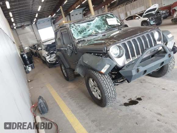 2020 Jeep Wrangler Willys z VIN 1C4GJXAG4LW237057, wystawiony jako IAAI lot #42044223 z przebiegiem 54 802 mil mil oraz . Historia ofert i sprzedaży dostępna na DreamBid. Obrazek 1.