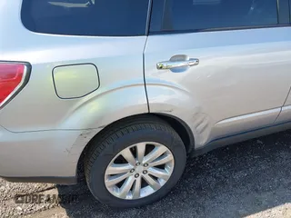 2012 Subaru Forester X Premium z VIN JF2SHADC8CH424853, wystawiony jako IAAI lot #42540390 z przebiegiem 217 063 mil mil oraz . Historia ofert i sprzedaży dostępna na DreamBid. Obrazek 14.