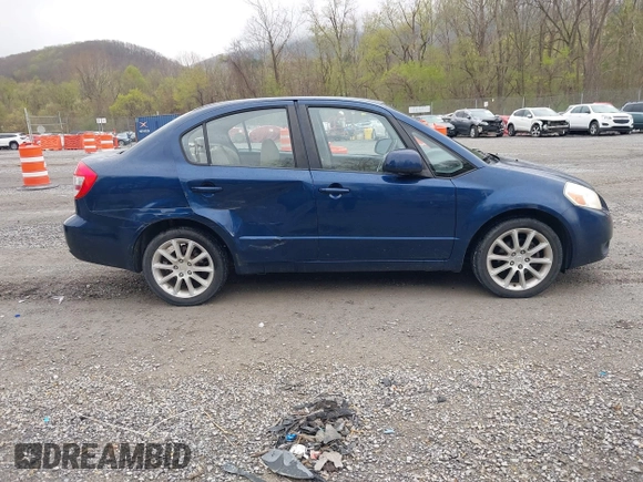 2011 Suzuki SX4 LE with VIN JS2YC5A23B6304713, listed as a IAAI auction lot 41997287 with 114,024 mi miles. Bid and sale history available at carsss.com. Image 13.