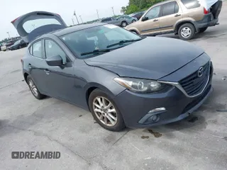 2015 Mazda 3 i Touring with VIN JM1BM1L79F1218498, listed as a IAAI auction lot 41876820 with 87,602 mi miles. Bid and sale history available at carsss.com. Image 1.