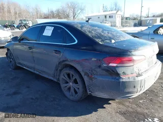 2021 Volkswagen Passat 2.0T SE with VIN 1VWSA7A35MC012802, listed as a IAAI auction lot 41416121 with 76,759 mi miles. Bid and sale history available at carsss.com. Image 3.