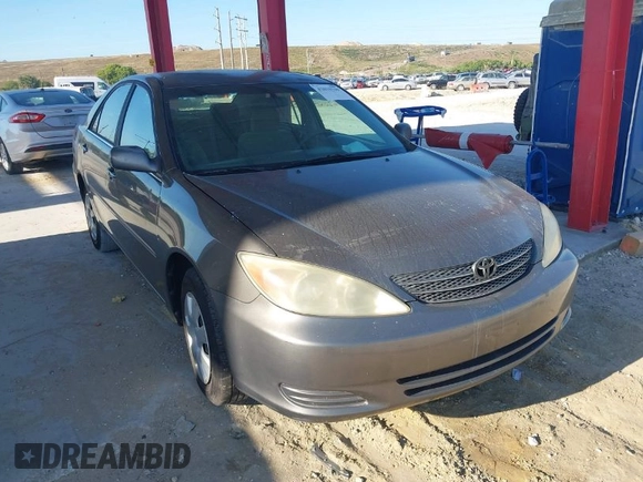 2004 Toyota Camry LE with VIN 4T1BE32KX4U916477, listed as a IAAI auction lot 42018299 with 149,247 mi miles. Bid and sale history available at carsss.com. Image 1.