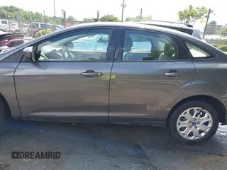 2012 Ford Focus SE z VIN 1FAHP3F22CL125941, wystawiony jako IAAI lot #42176898 z przebiegiem 157 940 mil mil oraz . Historia ofert i sprzedaży dostępna na DreamBid. Obrazek 14.