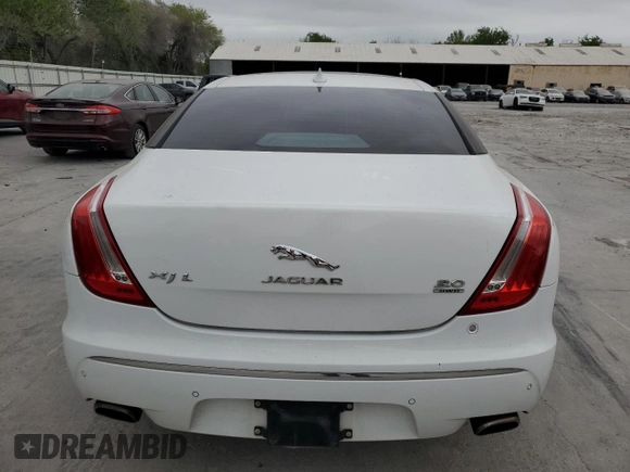 2014 Jaguar XJ Portfolio with VIN SAJWJ2GD6E8V65987, listed as a Copart auction lot 50091105 with 136,080 mi miles and Clean title. Bid and sale history available at DreamBid. Image 6.