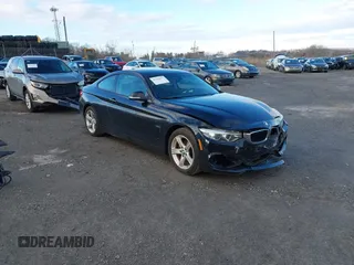 2014 BMW 4 Series 428i xDrive with VIN WBA3N9C5XEF722202, listed as a IAAI auction lot 41203677 with 73,077 mi miles and . Bid and sale history available at carsss.com. Image 1.