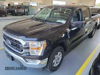 2021 Ford F-150 XL with VIN 1FTFW1E52MFB64744, listed as a IAAI auction lot 42733866 with 98,411 mi miles and . Bid and sale history available at DreamBid. Image 14.