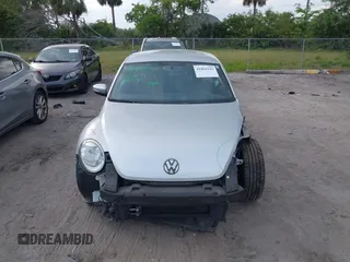 2012 Volkswagen Beetle 2.5L with VIN 3VWJX7AT9CM608065, listed as a IAAI auction lot 41864342 with 77,038 mi miles. Bid and sale history available at carsss.com. Image 12.