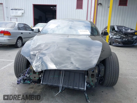 2023 Tesla Model S with VIN 5YJSA1E52PF528795, listed as a IAAI auction lot 42110660 with 21,243 mi miles and . Bid and sale history available at DreamBid. Image 12.