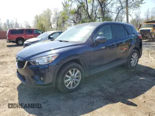 2014 Mazda CX-5 Touring with VIN JM3KE4CY4E0407868, listed as a Copart auction lot 52564315 with 137,989 mi miles and Salvage Title. Bid and sale history available at carsss.com. Image 1.